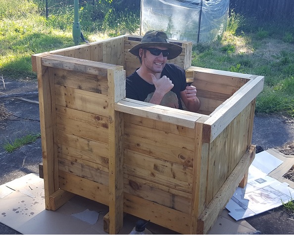 Christopher Pickering building an aquaponic fish tank from recycled materials