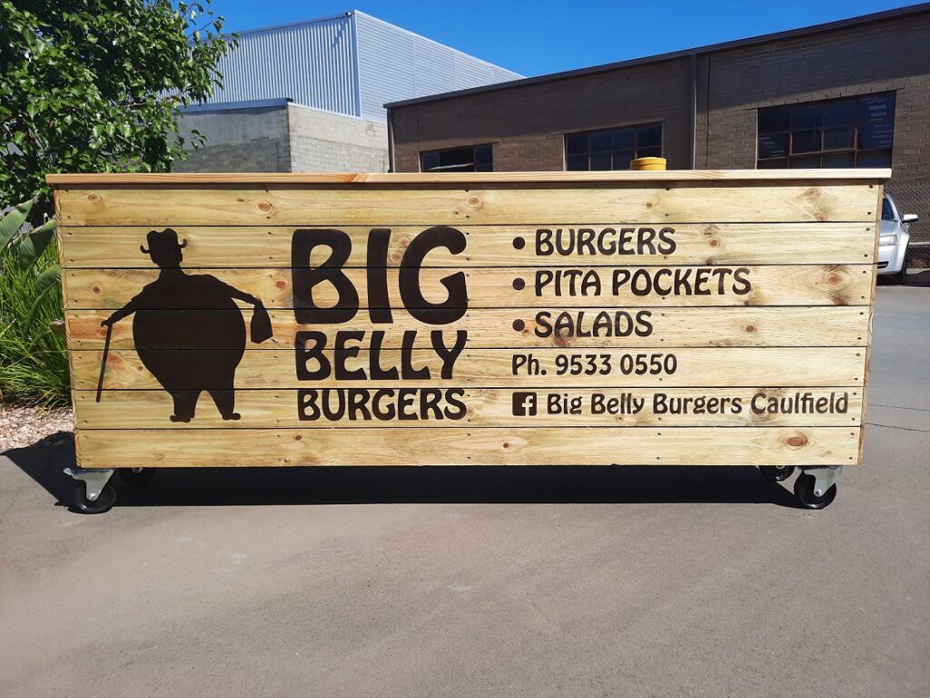 Outdoor dining planter box sprayed logo